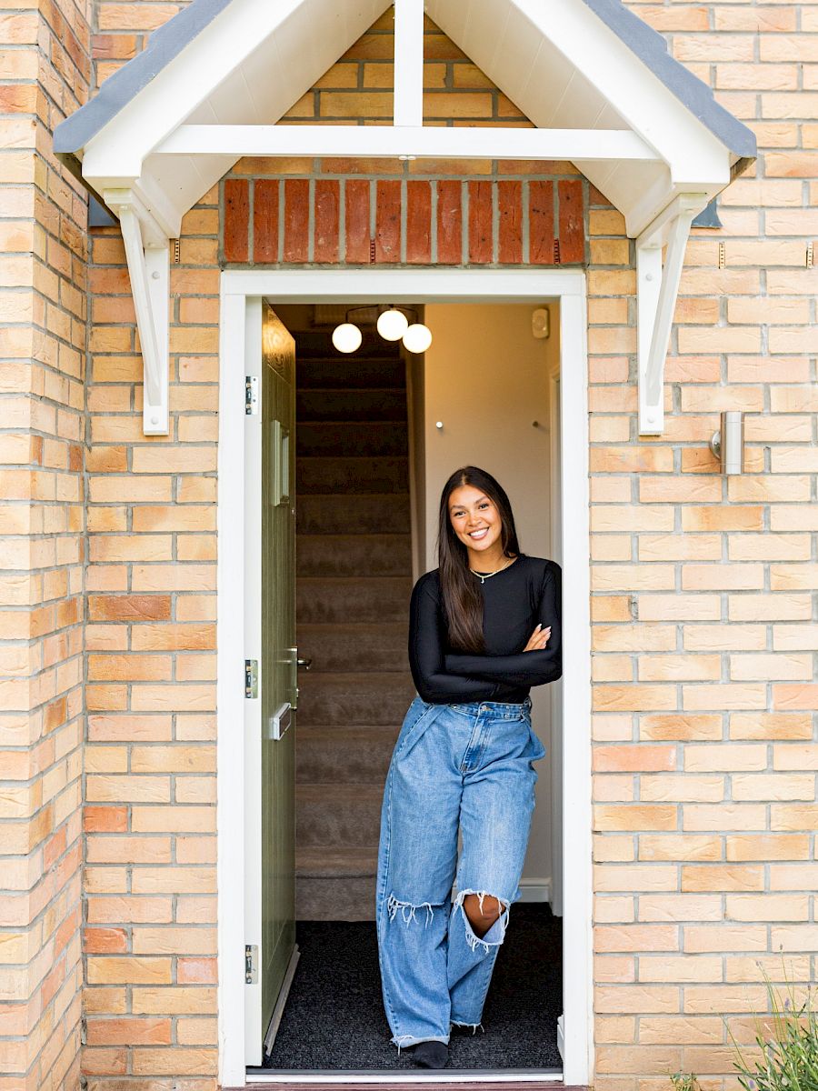 Girl stood in front doorway