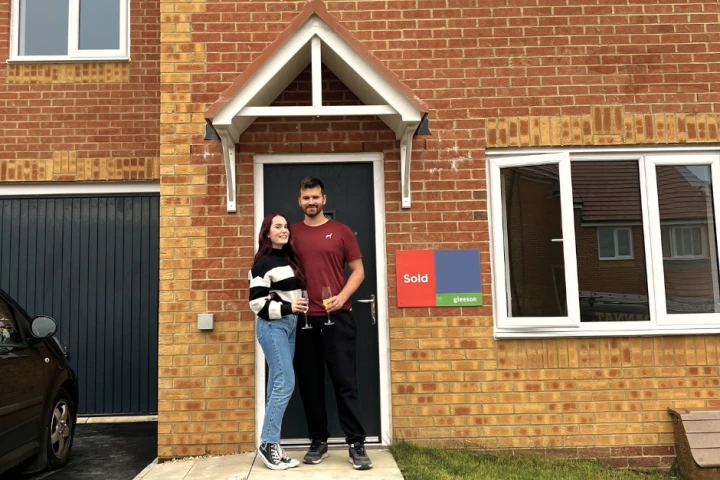 Couple stood at front door