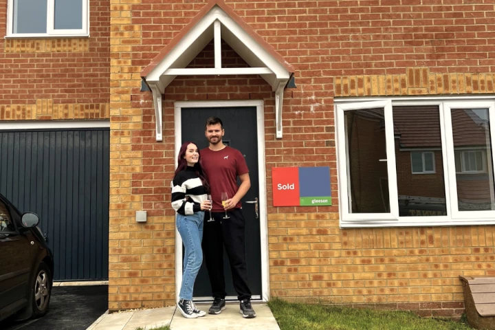 Couple stood at front door