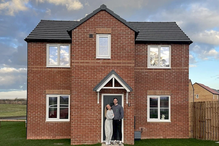 Gleeson customers in front of their home