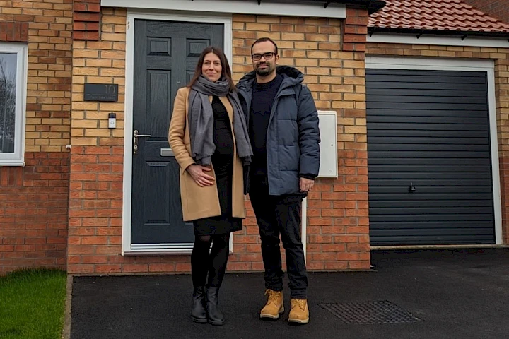 Couple at front of house