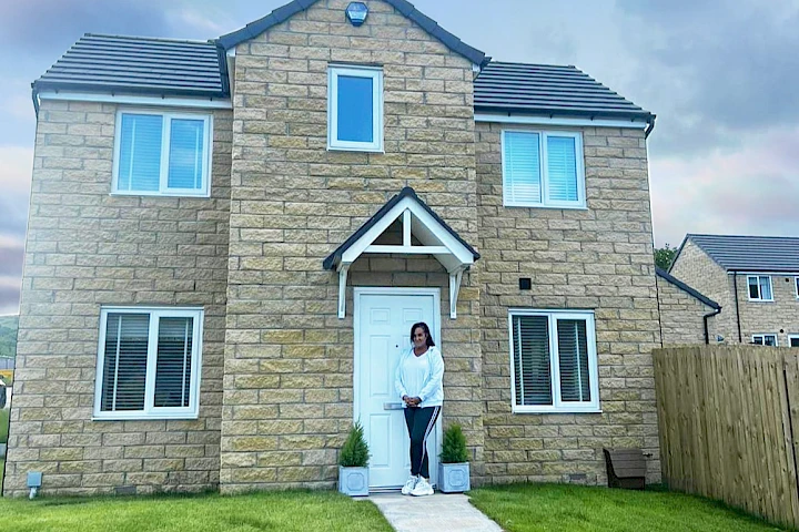 Customers in front of their home smiling