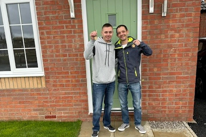 Gleeson homeowners stood at front door smiling