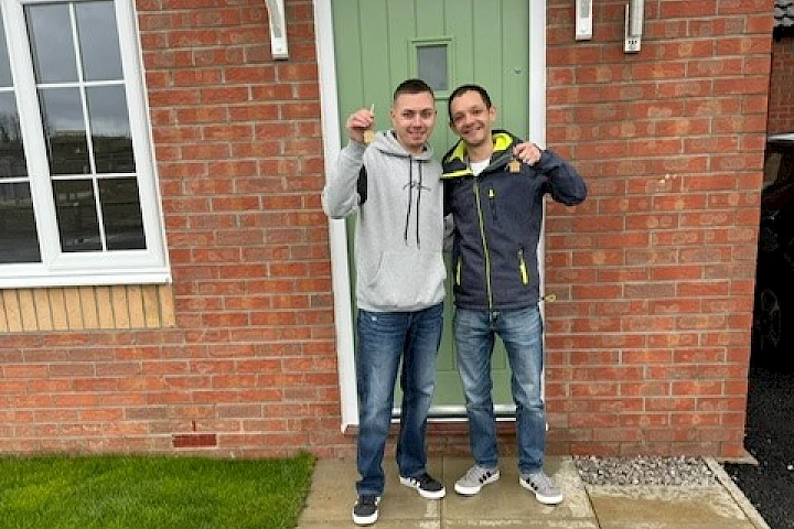 Gleeson homeowners stood at front door smiling