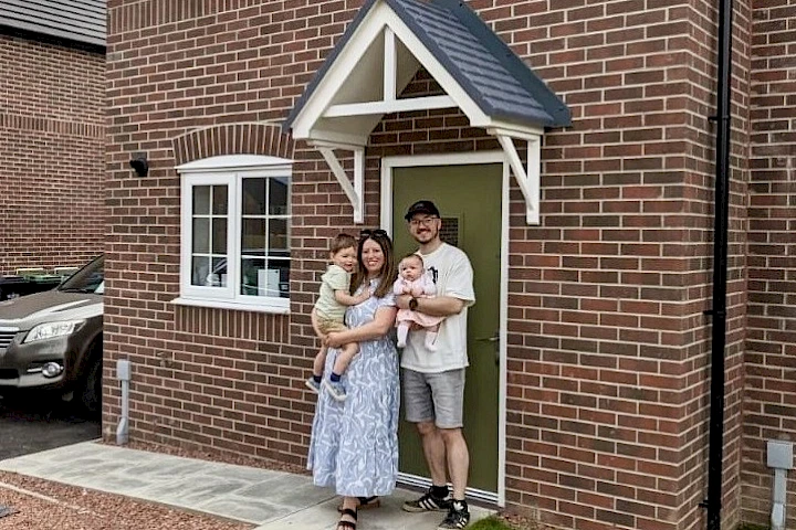 Family at the front of their home