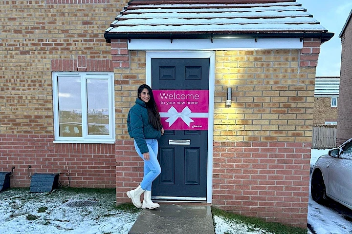 Solo homeowner at the front of her home