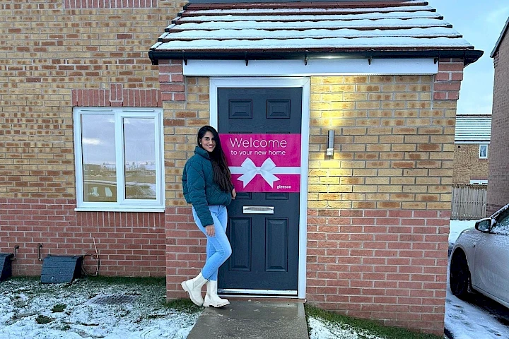 Solo homeowner at the front of her home