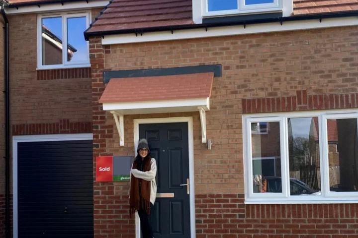 Solo homeowner at the front of her house
