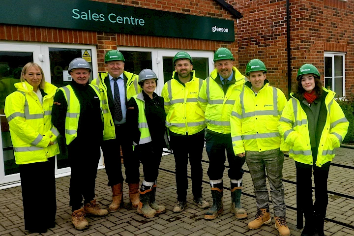 Sam Rushworth MP and Gleeson staff standing outside of a sales centre