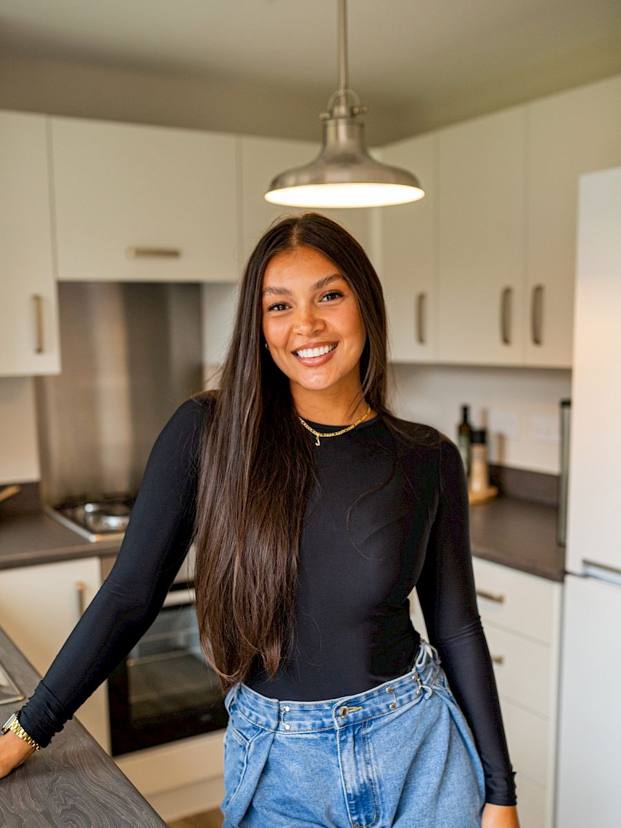 Girl stood in kitchen