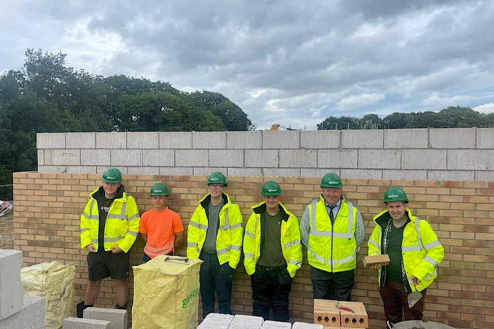Sam Rushworth MP pictured with Bishop Auckland college students on Bracks Farm site