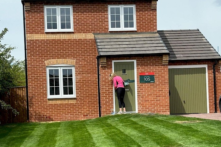 Customer at the front of her home