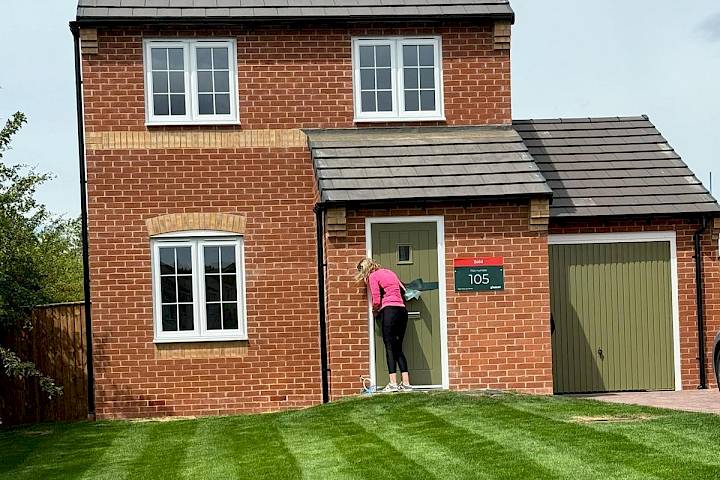 Customer at the front of her home