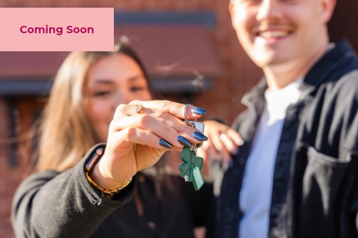 Young couple holding new home keys