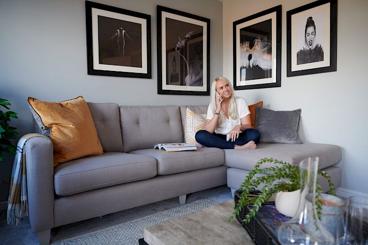 Woman relaxing on her sofa.