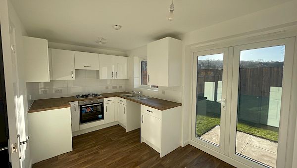 Kitchen with French doors to the rear garden.